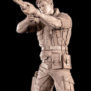 May include: A detailed sculpture of a person aiming a shotgun. The figure is dressed in tactical gear, including a vest, pouches, and cargo trousers. The sculpture is a neutral colour against a black background.