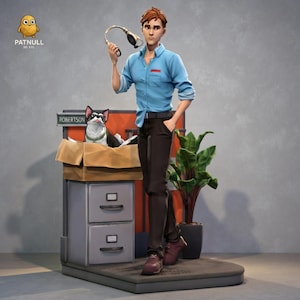 May include: A 3D-printed figurine of a man in a blue shirt and dark pants holding a headset. A dog is in a cardboard box on a filing cabinet. A potted plant is next to the man. The figurine has the text "PATNULL 3D STL".