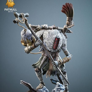 May include: A detailed 3D-printed figure of a character with a staff and a brush on its back. The figure has a white fur-like chest, wrapped limbs, and a bell-shaped headpiece. The figure is standing on a rocky base. The logo "PATNULL 3D STL" is visible.