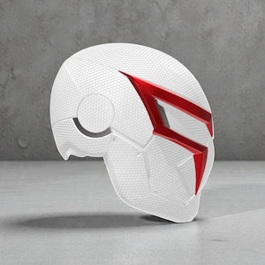 May include: A white mask with a textured surface and angular red accents. The mask has a futuristic design, with a circular opening on the side and a geometric pattern. The mask is likely for cosplay or costume use.