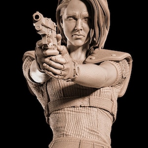 May include: A sepia sculpture of a person aiming a handgun, with a focused expression. The figure is wearing a textured top, gloves, and a watch. The background is black.