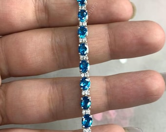 Pulsera de tenis de topacio azul y moissanitas / Plata de ley 925 / Joyería con la piedra de nacimiento de diciembre