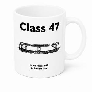May include: A white ceramic mug featuring a black graphic illustration of a Class 47 locomotive. The text "Class 47" is printed in bold black letters above the train, and the text "In use From 1962 to Present Day" is printed below the train.