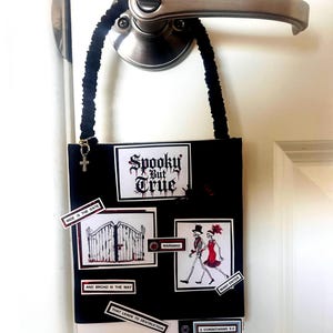 May include: A black rectangular door hanger with a fuzzy black strap. It features the text Spooky But True, Wide Is The Gate, And Broad Is The Way, That Leads To Destruction, Warning, Many Enter, and 2 Corinthians 6:2, with skeleton illustrations.