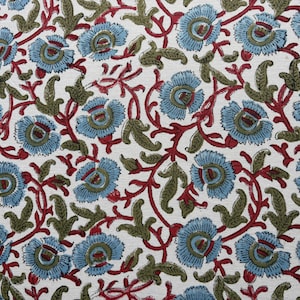 May include: A textile fabric featuring a repeating floral pattern on a white background. The design consists of light blue flowers with dark red centers, connected by winding dark red stems and olive green leaves throughout the surface.