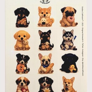 Könnte beinhalten: Ein Stickerbogen mit Illustrationen von Cartoon-Hunden. Die Hunde verschiedener Rassen und Farben halten Gegenstände wie einen Donut und ein Spielzeug. Der Bogen enthält den Text "Endres Craftroom" und Social-Media-Details.
