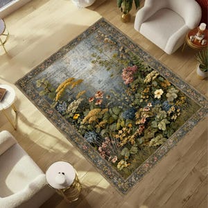 May include: A rectangular area rug featuring a detailed botanical print with clusters of yellow, blue, pink, and white wildflowers against a weathered, blue-grey background. The rug is framed by a decorative border with a repeating floral pattern.