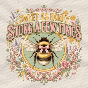 May include: A decorative image with a bumblebee wearing a pink bow, encircled by flowers and the words "Sweet as Honey, Stung a Few Times." The design uses pastel colours and a vintage style, suitable for clothing or home decoration.