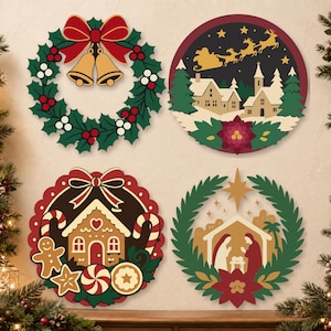 May include: Four circular Christmas wall decorations featuring festive designs: a green holly wreath with a red bow and gold bells, a snowy village scene with Santa and reindeer, a gingerbread house with sweets, and a nativity scene with a star.