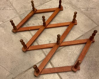 vintage accordion peg rack with 10 pegs . Used for coat organization as a coat rack, hat organization, Great for scarves