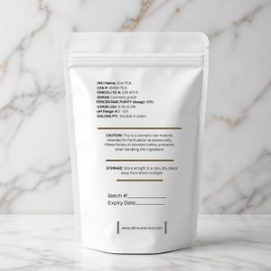 May include: A white, resealable stand-up pouch containing Zinc PCA cosmetic raw material. The label lists technical specifications including INCI Name, CAS # 15454-75-8, 98% purity, usage rate, pH range, solubility, safety cautions, storage instructions, and skincareclue.com.