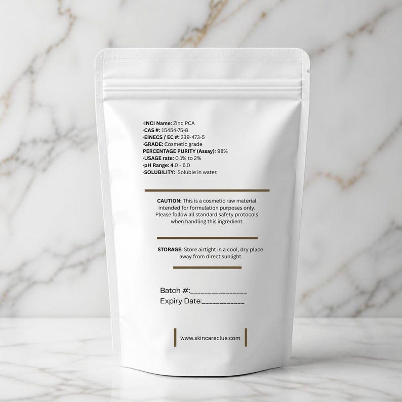 May include: A white, resealable stand-up pouch containing Zinc PCA cosmetic raw material. The label lists technical specifications including INCI Name, CAS # 15454-75-8, 98% purity, usage rate, pH range, solubility, safety cautions, storage instructions, and skincareclue.com.