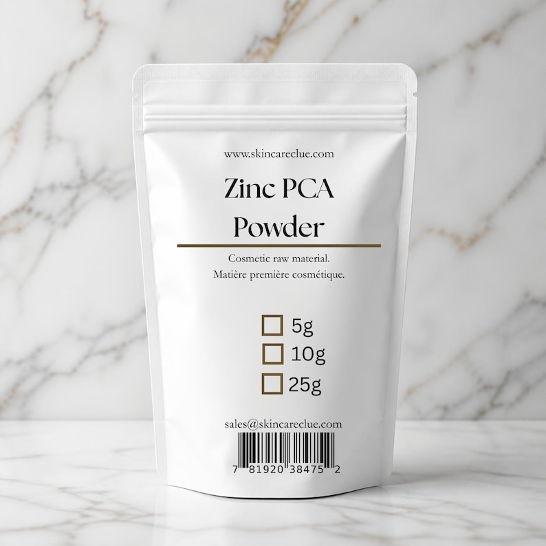 May include: A white stand-up pouch containing Zinc PCA Powder. The label features the text www.skincareclue.com, Zinc PCA Powder, Cosmetic raw material, and checkboxes for 5g, 10g, and 25g. The bottom includes an email address and a barcode.
