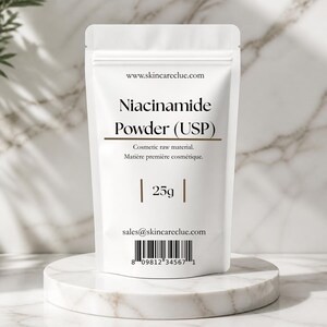 May include: A white stand-up pouch containing Niacinamide Powder (USP) cosmetic raw material. The label displays the website www.skincareclue.com, the weight of 25g, the email sales@skincareclue.com, and a barcode with the number 8 09812 34567 1.