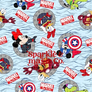 May include: A light blue fabric featuring a repeating pattern of Marvel and Disney characters, including Mickey Mouse, Captain America, and Iron Man. The design includes the text "Sparkle & Co." and "Marvel Day At Sea" logos.