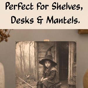 May include: A square wooden sign featuring a sepia-toned photograph of three children dressed in witch costumes with pointed hats, standing near a rustic wooden structure. The sign is displayed on a small, light-colored wooden easel stand.