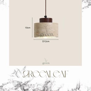 May include: A cylindrical pendant light with a brown top and a beige, textured body. The light fixture is 10cm high and 12cm in diameter. The word "green" is printed on the light fixture.