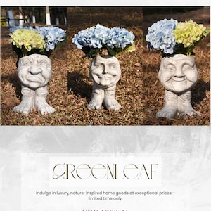 May include: Three concrete face planters with legs, each holding blue and yellow flowers. The planters have different facial expressions: a frown, a neutral expression, and a smile. The text "GREENLEAF" and "NEW ARRIVAL" are also visible.