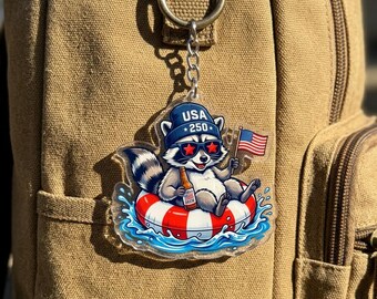 Funny USA 250th Anniversary Raccoon Keychain, Patriotic Raccoon in Pool Float Keyring, Unique US Pride Gif