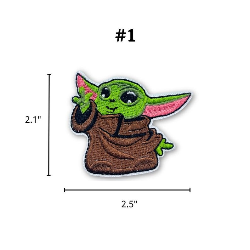 May include: Embroidered patch featuring a green character with large eyes and pointed ears, wearing a brown robe. The patch is 2.5 inches wide and 2.1 inches tall, with the text "#1" above the character.