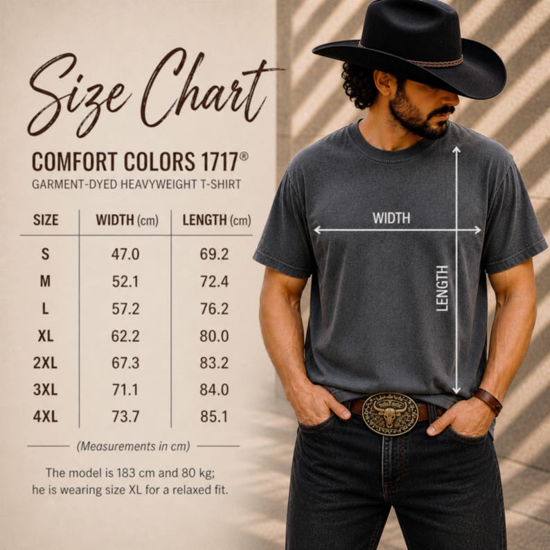 May include: A size chart for a Comfort Colors 1717 garment-dyed heavyweight t-shirt, with measurements in centimeters. The chart includes sizes S to 4XL, with corresponding width and length measurements. A man wearing a gray t-shirt and a black hat is shown.