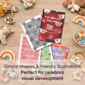 May include: A collection of high-contrast baby books with bear and bird illustrations. The books are in various colors, including red, green, and gray, and are designed to support visual development from birth to 6 months. The text on the books reads "High-Contrast Baby Book".