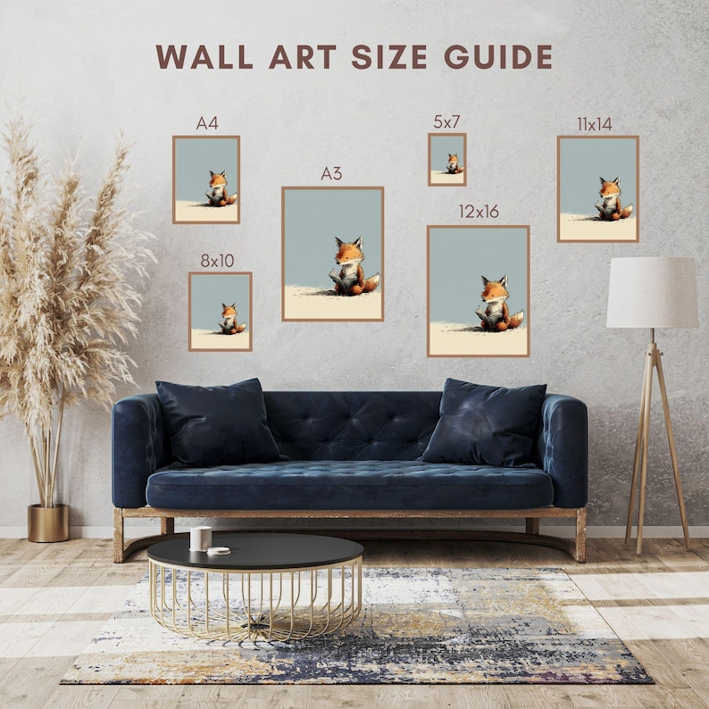 May include: A wall art size guide featuring six framed prints of a fox sitting on a sandy surface against a light blue background. The prints are labeled A4, A3, 5x7, 8x10, 11x14, and 12x16. The text WALL ART SIZE GUIDE is displayed at the top.