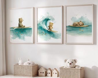 May include: Three framed wall art prints featuring watercolor illustrations of brown bears on surfboards. The first shows a bear sitting, the second a bear surfing a teal wave, and the third a bear sleeping on a surfboard in calm water.