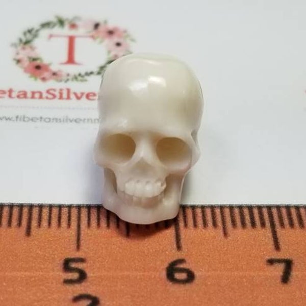 1 pc of 15x8mm 3D Skull side to side drilled in Bleached White hand Carved Water Buffalo Bone.