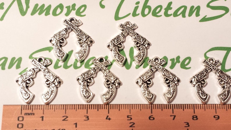 12 pcs per pack 23x22mm Crossed Gun Charms Antique Silver Lead free Pewter. image 1