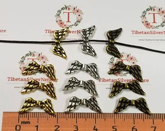 24 szt. w opakowaniu 21 x 6 mm koraliki w kształcie skrzydeł anioła w kolorze antycznego srebra, złota lub brązu, bez ołowiu, cyna