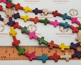 16 inches of 16x12mm Top to the bottom Drilled Cross Multi-color Dyed Magnesite.