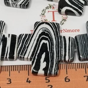 2 pcs per pack 30mm center Drilled Cross Black and White Dyed Magnesite.