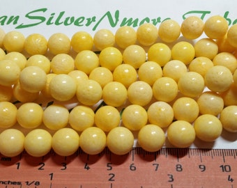 A full strand 36 pcs of 12mm Round Bright Yellow Dyed Sponge Coral