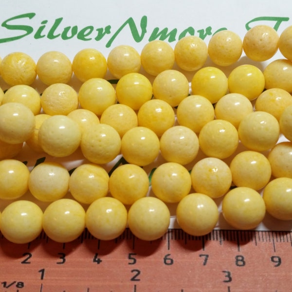 A full strand 36 pcs of 12mm Round Bright Yellow Dyed Sponge Coral