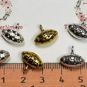 10 pcs per pack 14x8mm Solid Football Charms Antique Silver, Gold or Shiny Silver Lead free Pewter.