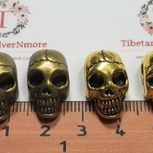 4 pcs per pack 20x11x9mm side to side drilled Flat back Oval Hole Beads Skull in antique Silver, Gold or Bronze Lead free Pewter.