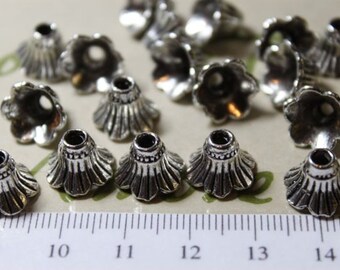 12 piezas por paquete 12x10mm Flor corrugada Acabado texturizado Cono Plata Antigua Plata Sin Peltre