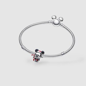 Authentic sterling silver Mickey Mouse charm wearing red Santa hat and holding candy cane for Christmas jewelry.