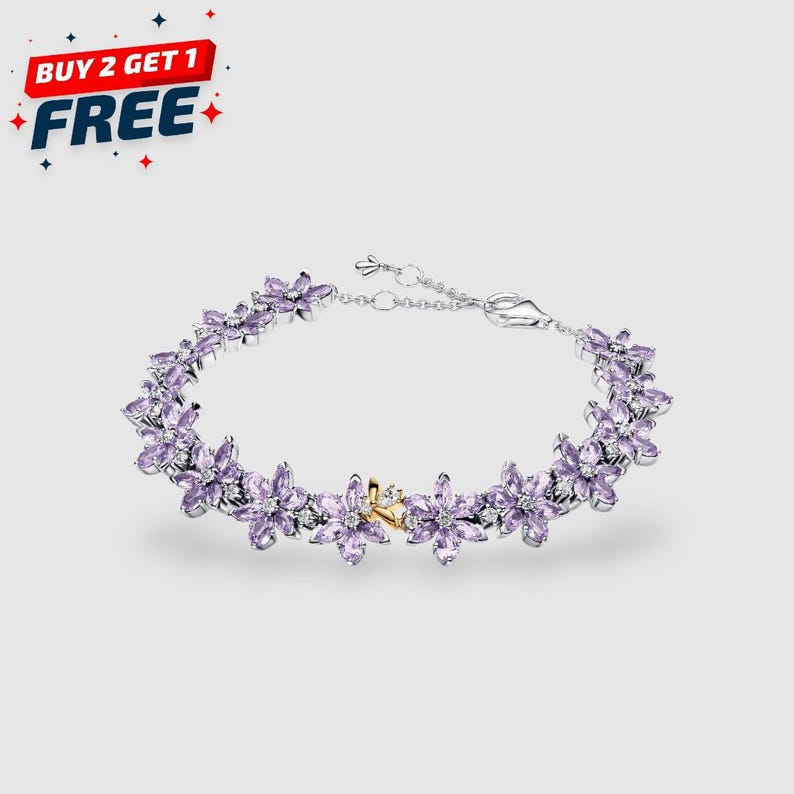 Gold plated tennis bracelet featuring a central Herbarium honeybee motif with marquise stones, regal regency style wristwear