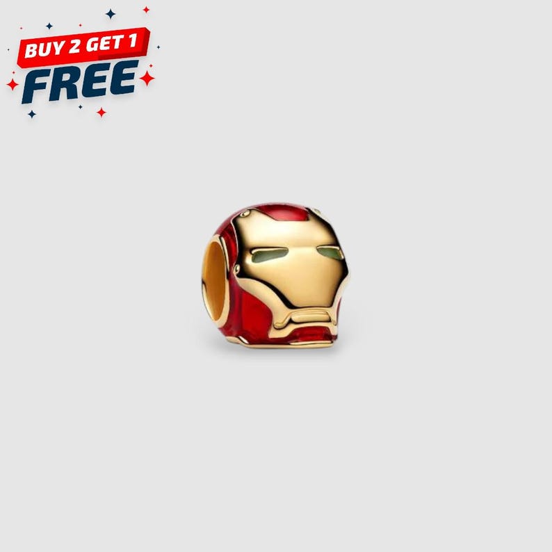 14k gold-plated Iron Man helmet charm with red enamel details and white glow-in-the-dark eyes.