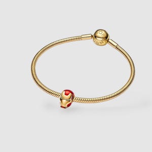14k gold-plated Iron Man helmet charm with red enamel details and white glow-in-the-dark eyes.