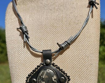 Fossil soup stone leather pendant