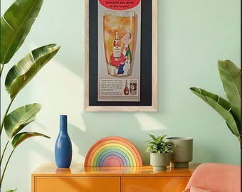 Stampa pubblicitaria vintage 8x15 cm (1960) del brandy Coronet VSQ, incorniciata ed esposta come oggetto da collezione.