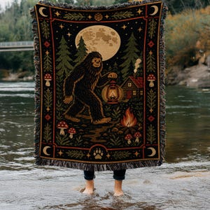 Bigfoot Cabin Woven Blanket, Moonlit Forest Woodland Tapestry Throw, Sasquatch Campfire Mushroom Scene, Rustic Cryptid Wall Hanging Gift
