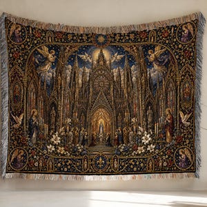 May include: A woven tapestry throw featuring a detailed gothic cathedral scene with a central figure, surrounding angels, white lilies, and ornate architectural arches in shades of deep blue, gold, and cream with a fringed edge on all sides.