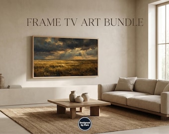 May include: A framed landscape painting with a stormy sky and golden field hangs above a low, square wooden coffee table. The room features a neutral color palette, a beige sofa, and a woven rug. Text at the top reads "FRAME TV ART BUNDLE."