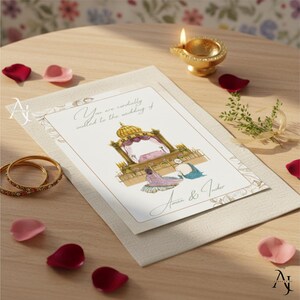A wedding invitation card displaying an illustrated Sikh ceremony scene rests on a wooden table surrounded by rose petals, two gold bangles, and a lit oil lamp.