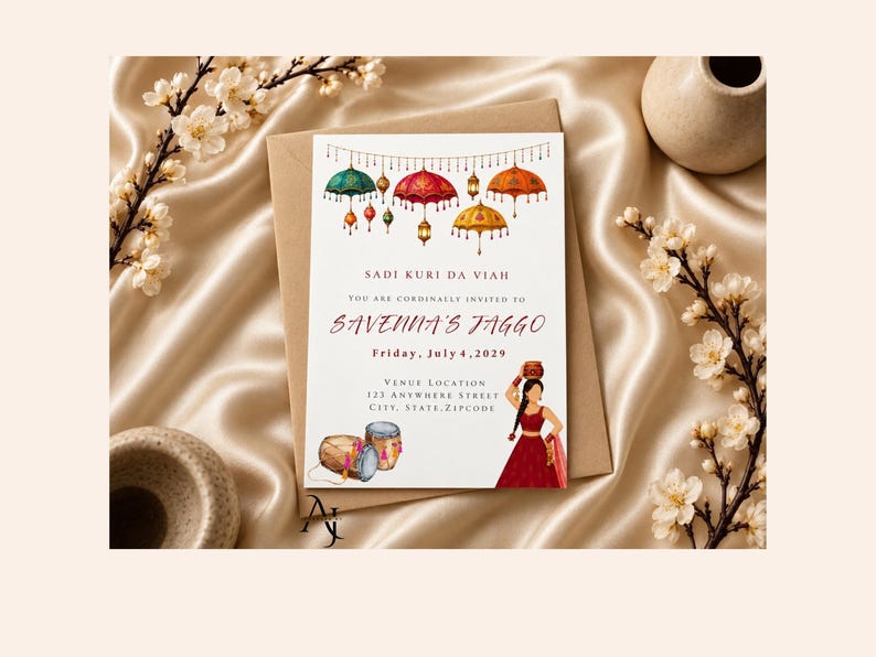 May include: A rectangular invitation card featuring colorful hanging umbrellas and lanterns at the top. The text reads SADI KURI DA VIAH, YOU ARE CORDINALLY INVITED TO SAVENNA'S JAGGO, Friday, July 4, 2029, and venue details. A person in a red outfit holds a pot.