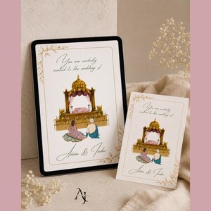 A digital tablet displaying an Indian wedding invitation card sits on a fabric surface beside a printed card with the same design.
